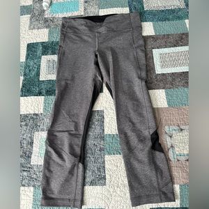 NWOT 8 Lululemon cropped leggings. Grey with black mesh